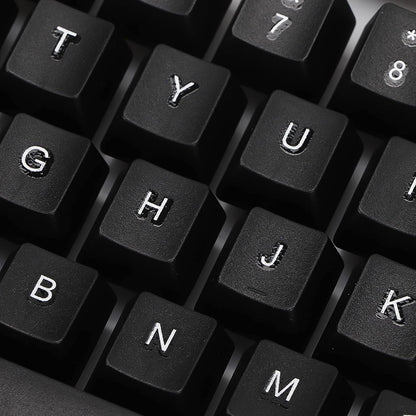 Angled view of the wired keyboard, highlighting its full-size layout and ergonomic key placement.