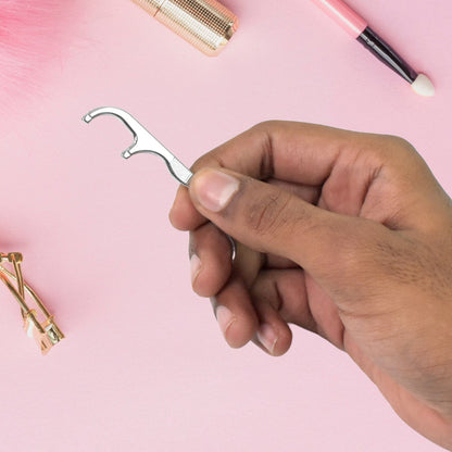 AuriGlam 7-piece stainless steel toothpick and floss kit, ready for travel.