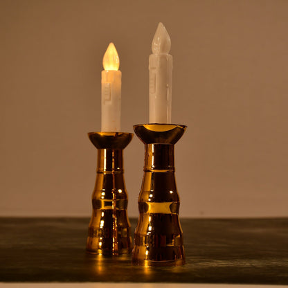 A pair of decorative flameless LED candle lights creating a warm ambiance.
