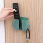 Compact wallmount mobile stand with integrated hook, holding a smartphone and keys.