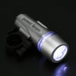 Bright LED bicycle headlight securely mounted on a bike handlebar.