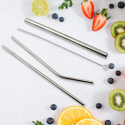 Assortment of straight and bent stainless steel straws displayed on a clean surface.