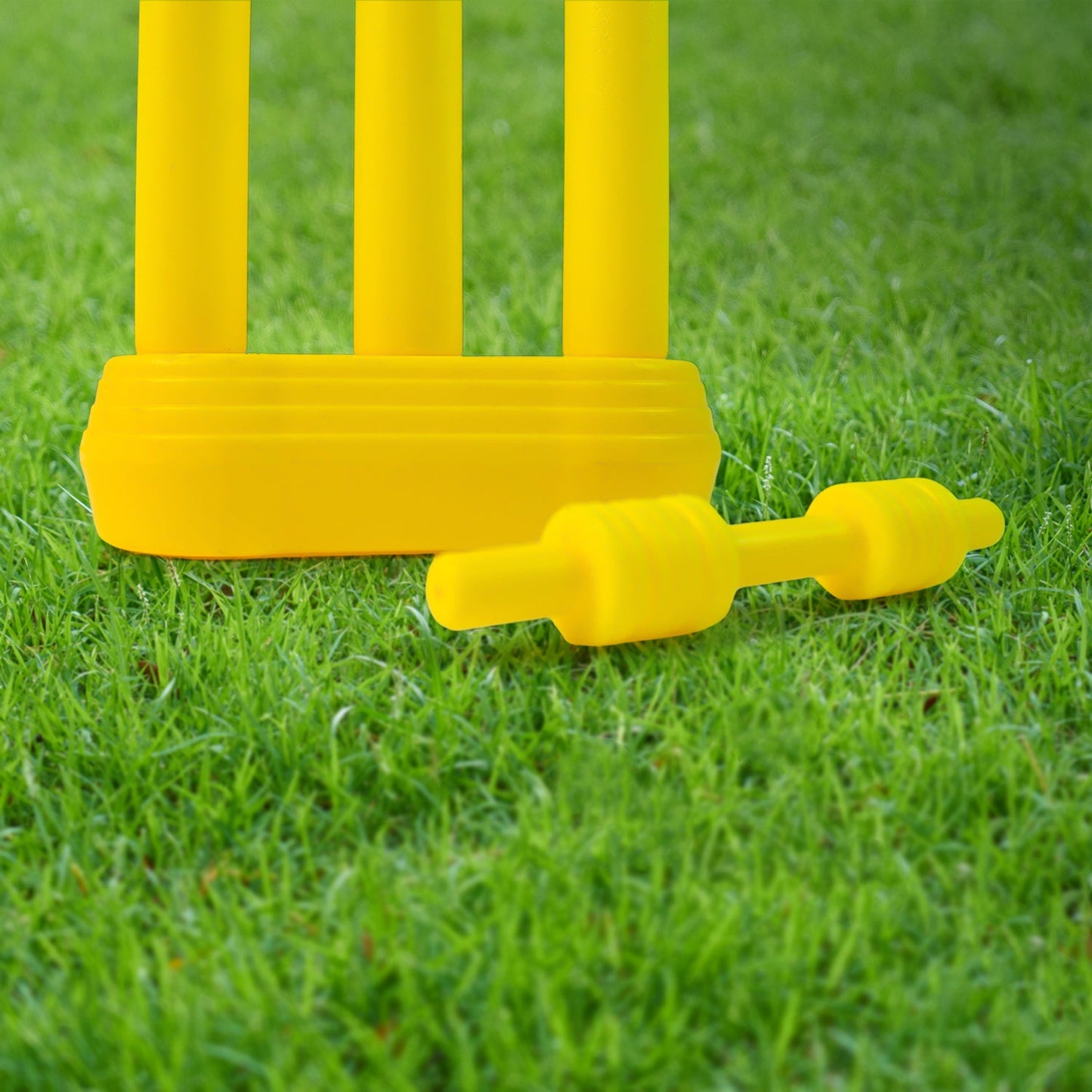 Components of the Aditi Kids Cricket Kit, including stumps and base.