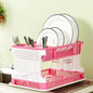 Pink kitchen organizer rack with a water storing tray arranged neatly on countertop
