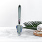 Triangular Sponge Brush effortlessly cleaning a kitchen sink.