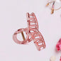 Matte plastic hair clamp angled view showing durable grip
