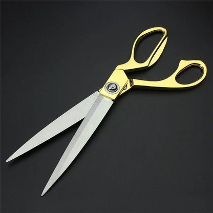 Professional golden scissors demonstrating sharp cloth cutting capability.