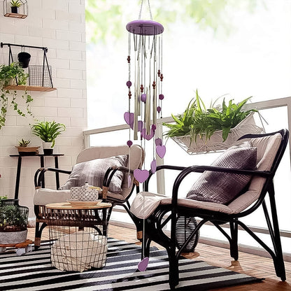 Side view of the handcrafted bamboo and aluminium wind chime with heart accents.