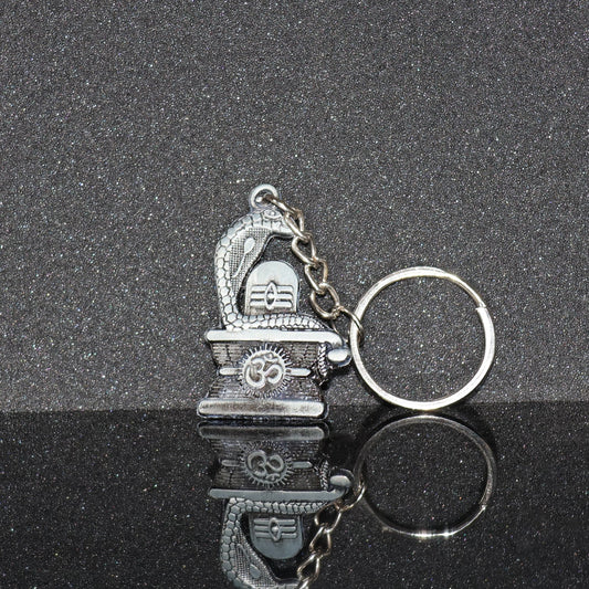 Elegant Shivling keychain with snake design in silver metal
