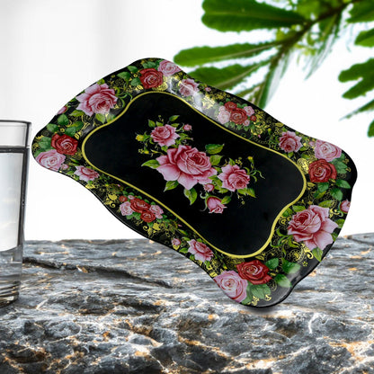 Floral stainless steel serving tray on a dining table, showcasing its aesthetic appeal.