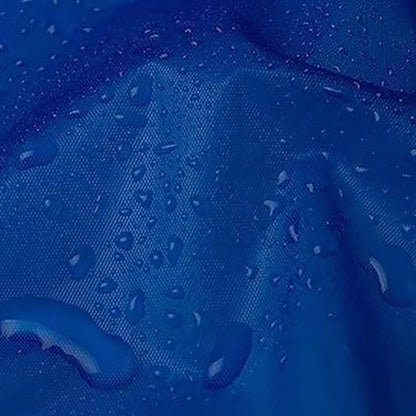 A close-up of a blue waterproof fabric with small water droplets beading on its surface.