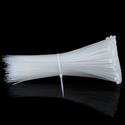 Detail view of the self-locking mechanism on a strong nylon cable tie.