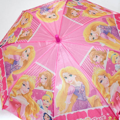 A close-up view of the pink umbrella canopy shows multiple cartoon princesses with long blonde hair.