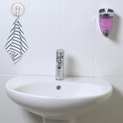 Clear plastic suction cup hook holding decorative hanging items