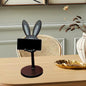 Adjustable Bunny Phone Stand on a desk, showcasing its cute design.