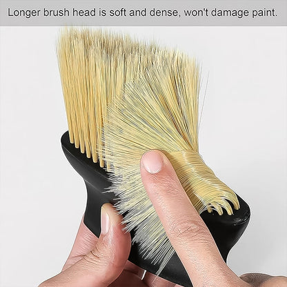 Ergonomic cleaning brush easily dusting a car's air outlet, showing its comfortable grip and effective reach.