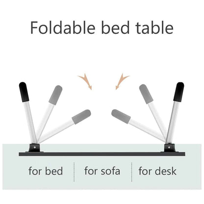 Individual using the portable bed desk for reading a book and taking notes in a relaxed setting.