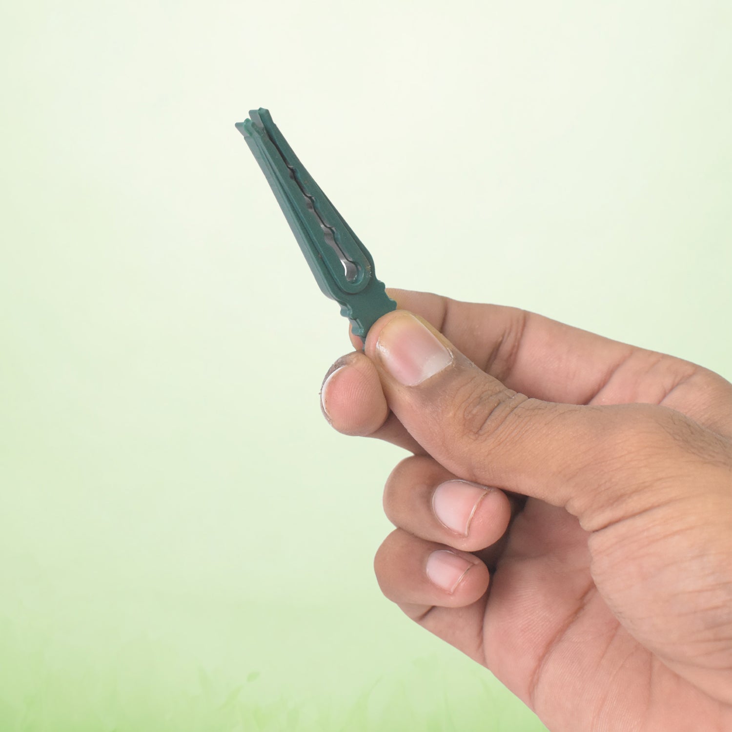 Multiple plastic cloth pegs holding laundry on a drying rack, showcasing their multipurpose use.