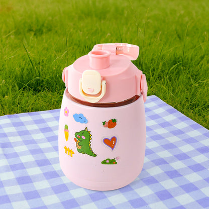 Insulated water bottle standing upright on a surface