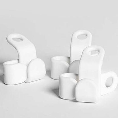 Organised display of white hanger connector hooks for closet management.