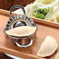 Stainless steel dumpling maker with a perfectly sealed dumpling.