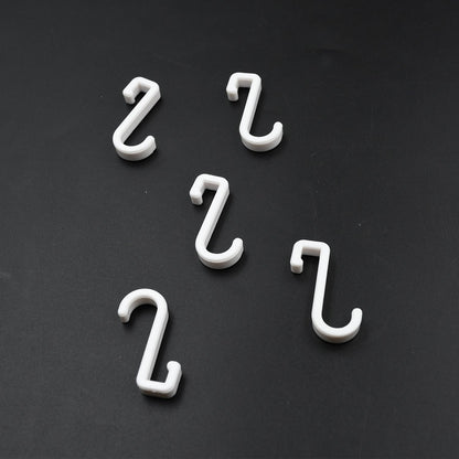 Multi-angle view of the strong self-adhesive plastic hook, highlighting its sleek design.