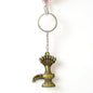 Close-up of Lord Shiva Shivaling metal keychain with detailed serpent design