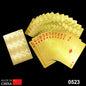 Gold plated playing cards shimmering on a table, ready for a game.