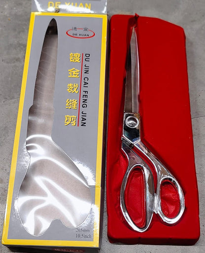 Top-down view of Cisora's gold-plated cloth cutting scissors, highlighting precision.