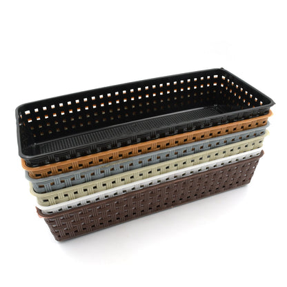 Plastic storage bins used as kitchen drawer dividers for cutlery and utensils.