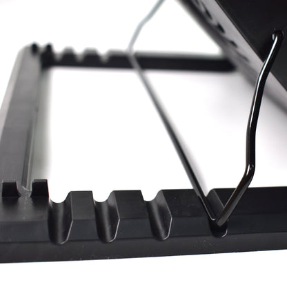 Laptop cooling fan pad with blue LED lights, enhancing the gaming setup.