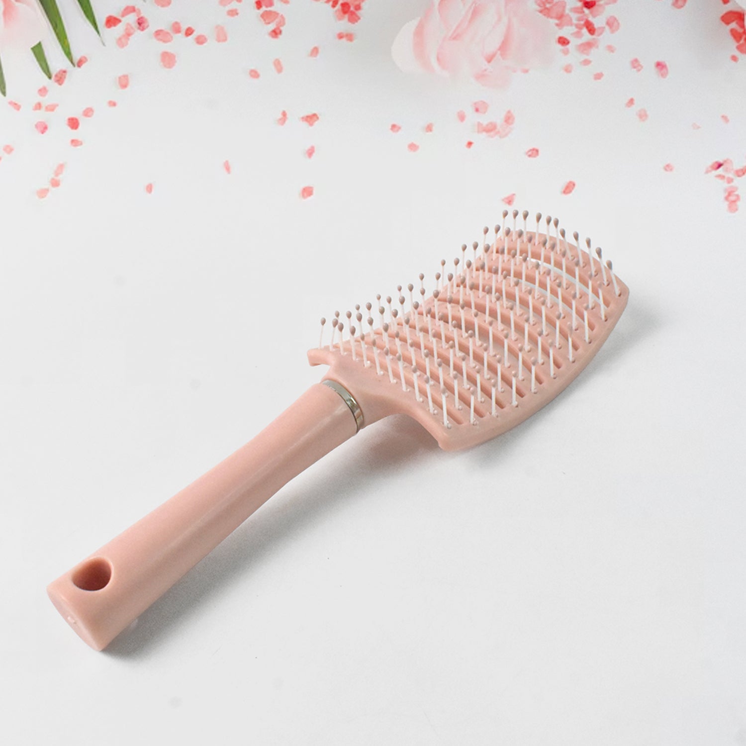 Close-up of massage hair comb bristles designed for scalp stimulation