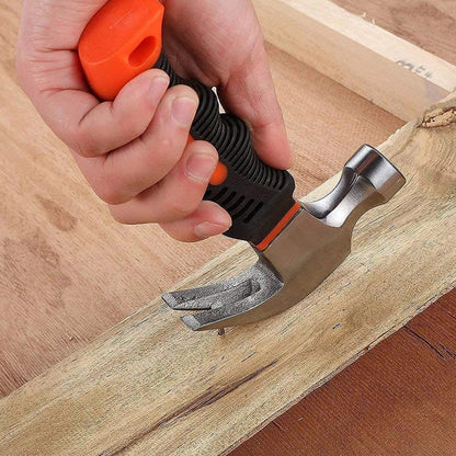 The compact mini claw hammer displayed next to a measuring tape, showing its 15 cm length.