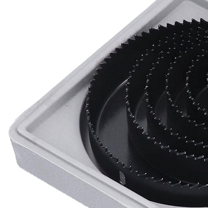 Multiple carbon steel hole saws of different diameters, highlighting the range available in the kit.