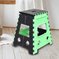 Open 18-inch brown folding stool made of sturdy plastic, ready for use.