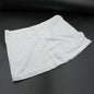 Women's high-waisted athletic skort front view in white.