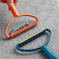 Portable lint remover with long handle, demonstrating its dual fabric brush and copper blade.