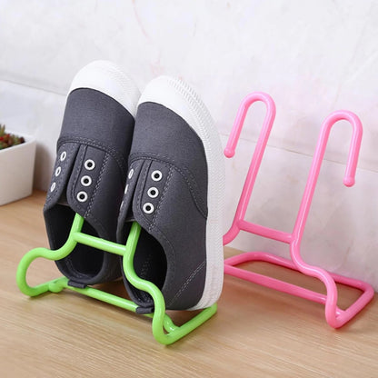 Space-saving drying shelf with integrated shoe and hanger stand, perfect for small apartments.