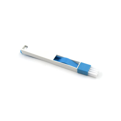 The compact cleaning brush efficiently removing dust and dirt from a window groove.