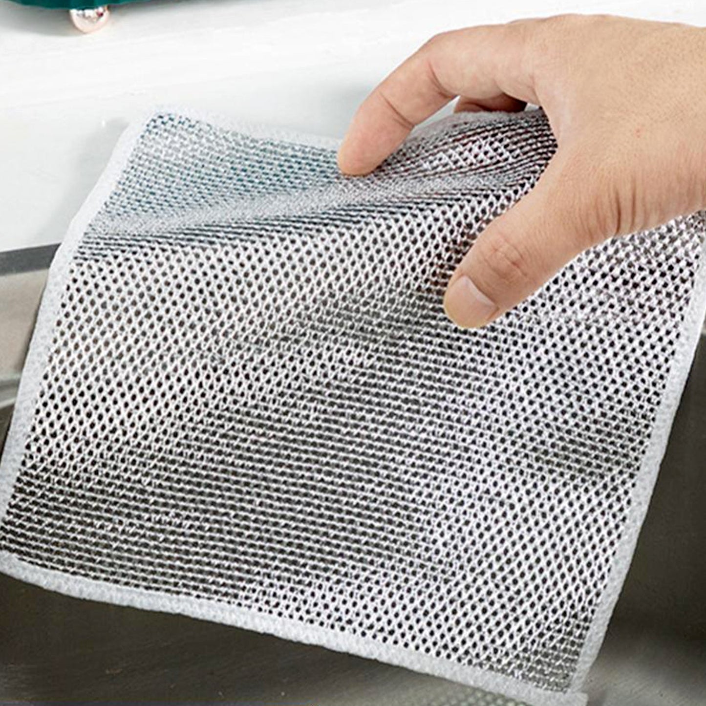 Double-sided microfiber scrubber cloth for effective kitchen cleaning.