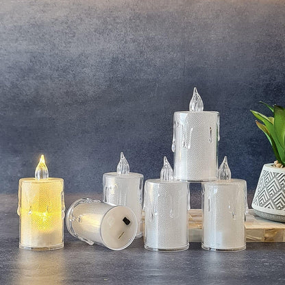 Crystal LED candle illuminating a festive corner with traditional Indian decor.