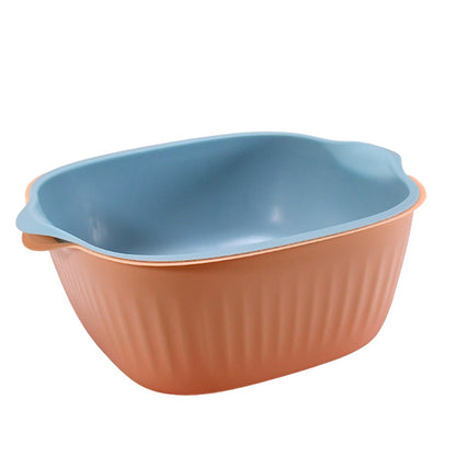 Compact plastic washing bowl with drainer, ideal for fruits and vegetables.