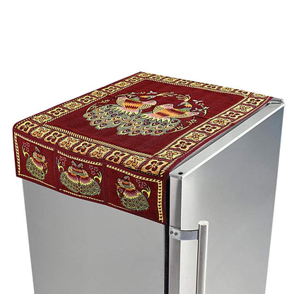 Cotton fridge top cover with peacock design and side pockets on a refrigerator.