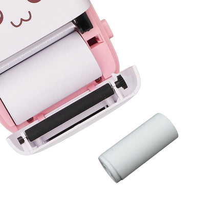 A hand holding a single Papezo thermal printer paper roll, emphasizing its portable size.