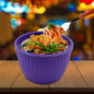 Plastic noodles bowl for a quick meal, showcased on a clean surface.