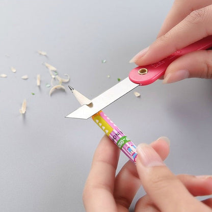 Vibrant multicolour handle of a mini paper cutter knife showing ergonomic design.