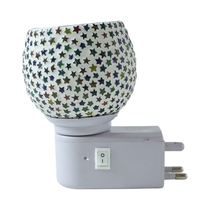 Warm glowing star pattern mosaic glass night lamp creating cozy ambience