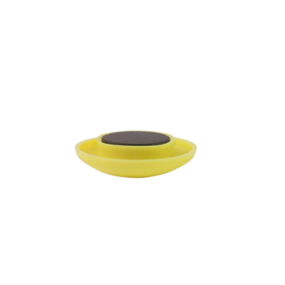 Stack of bright yellow circular plastic magnetic buttons
