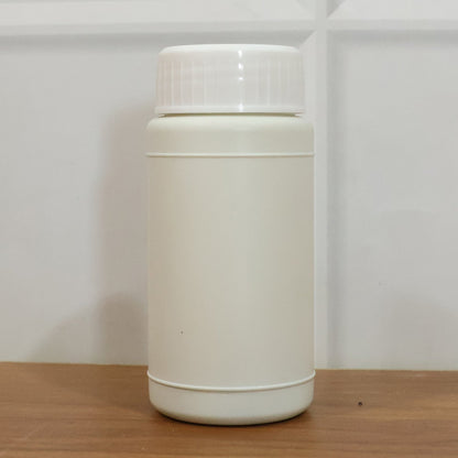 Blue automatic toilet bowl cleaner tablet in water tank