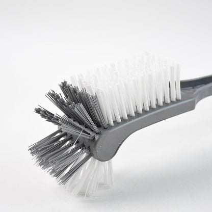 Long handle toilet cleaning brush shown angled for under-rim reach